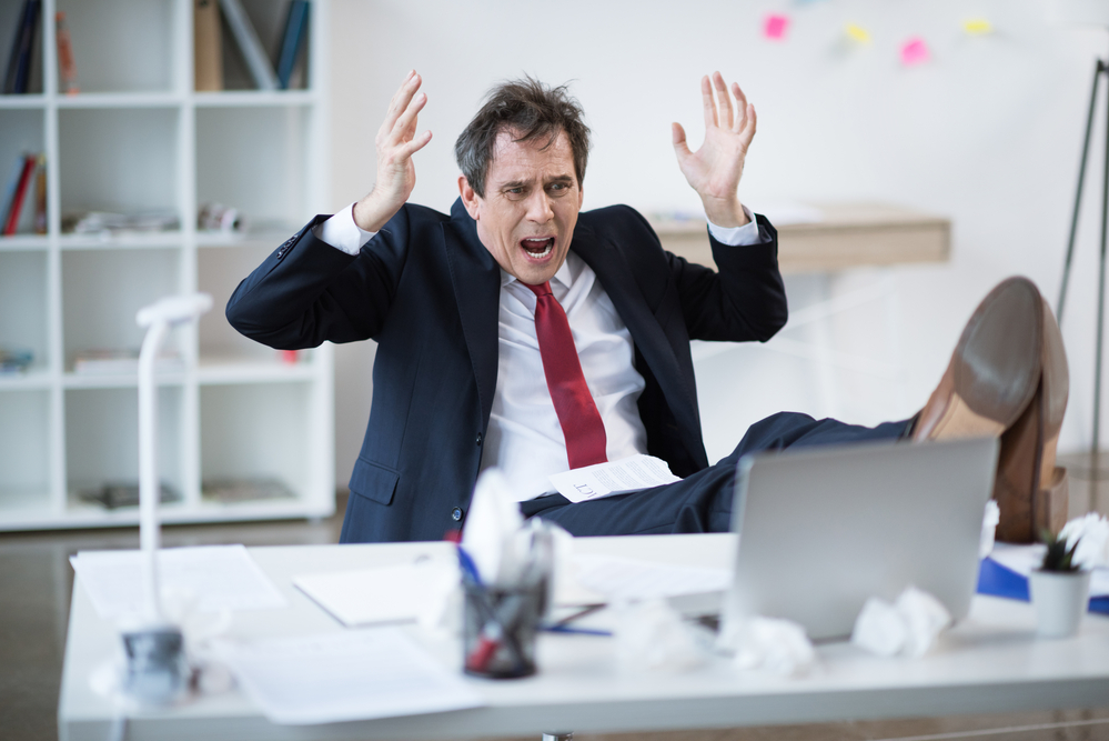 Panicked Businessman at Desk