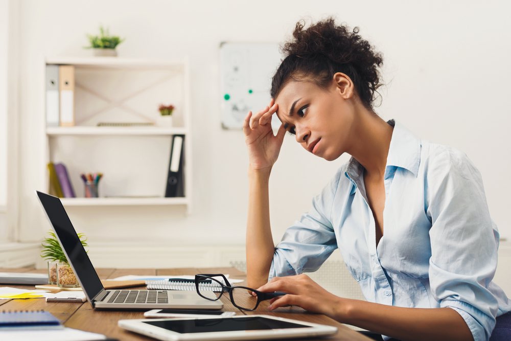 Stressed woman working at computer