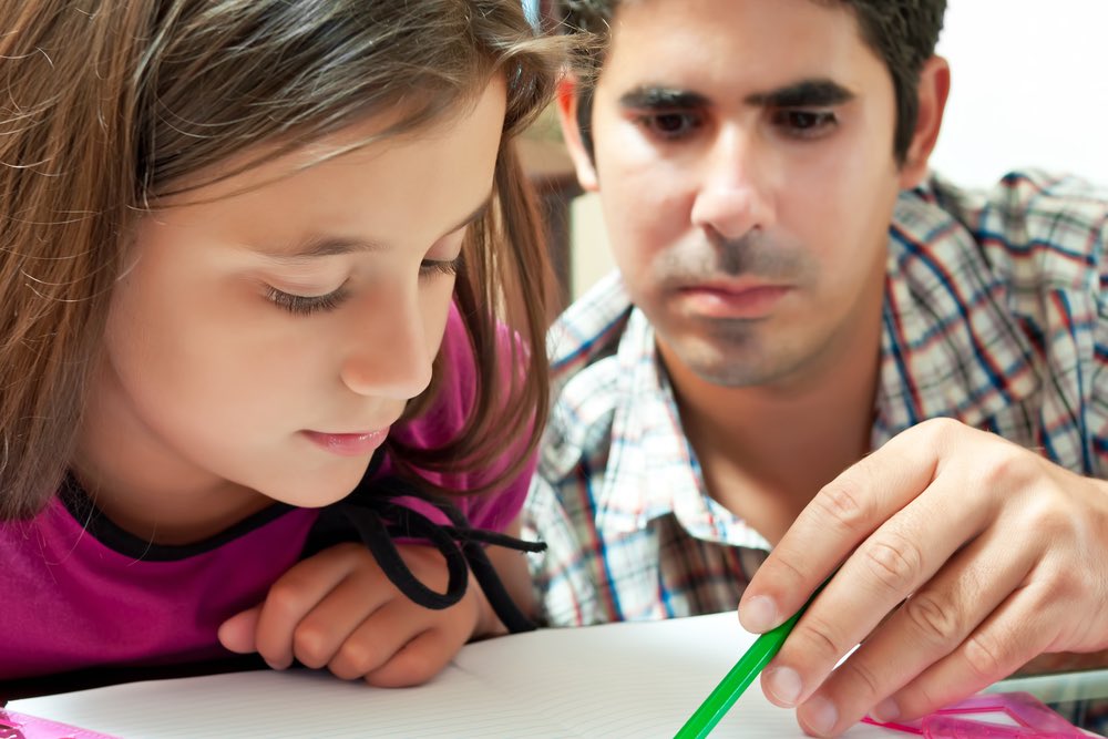 Father Helping Daughter with Project