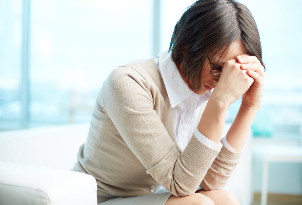 Tired Woman Face Buried in hands