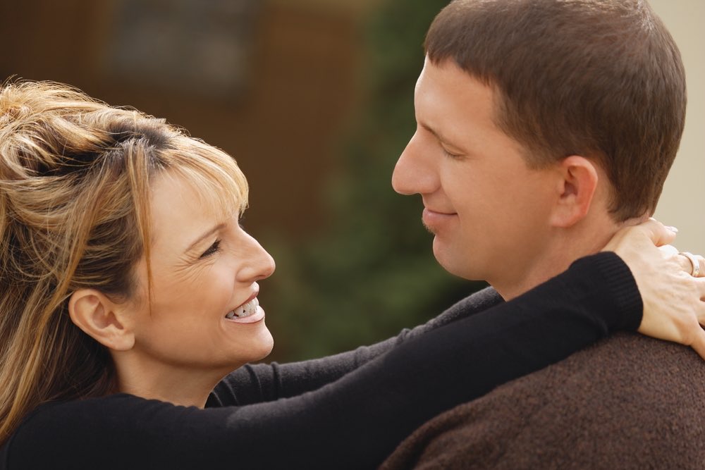 Procrastination Couple Looking at Each other in Eyes